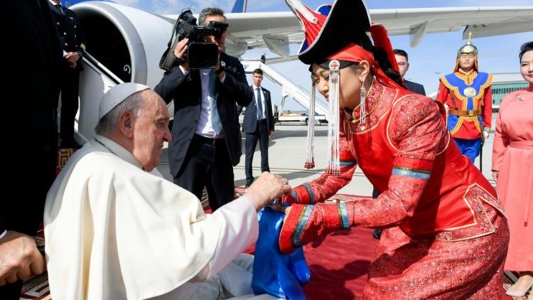 Mongolian lady Giving Yogurt to Pope