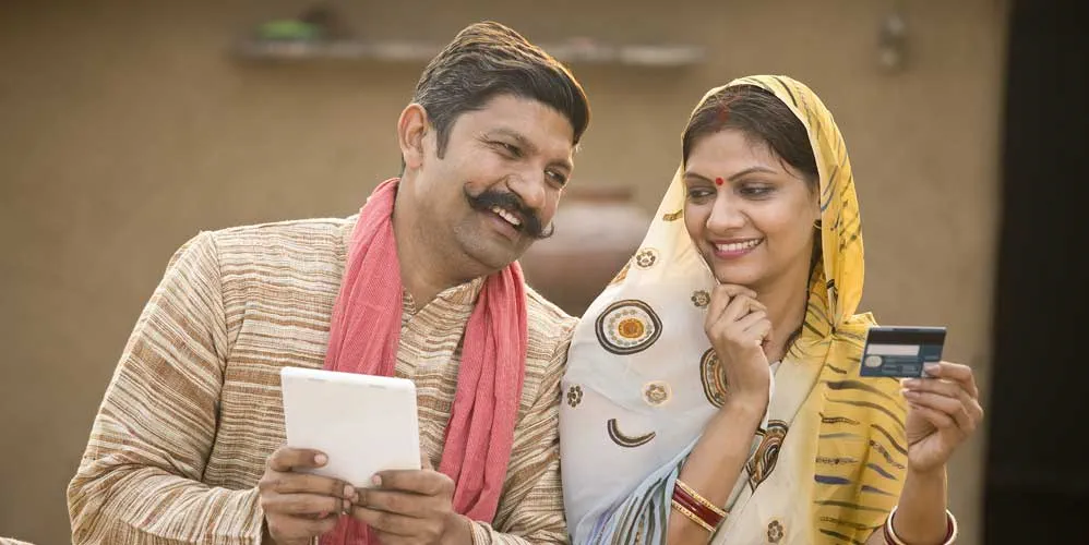 In August 2014, Modi introduced the Pradhan Mantri Jan Dhan Yojana (PMJDY). The plan promised to provide 150 million families with bank accounts, debit cards, accident insurance, and a Rs. 5000 ($63) overdraft.