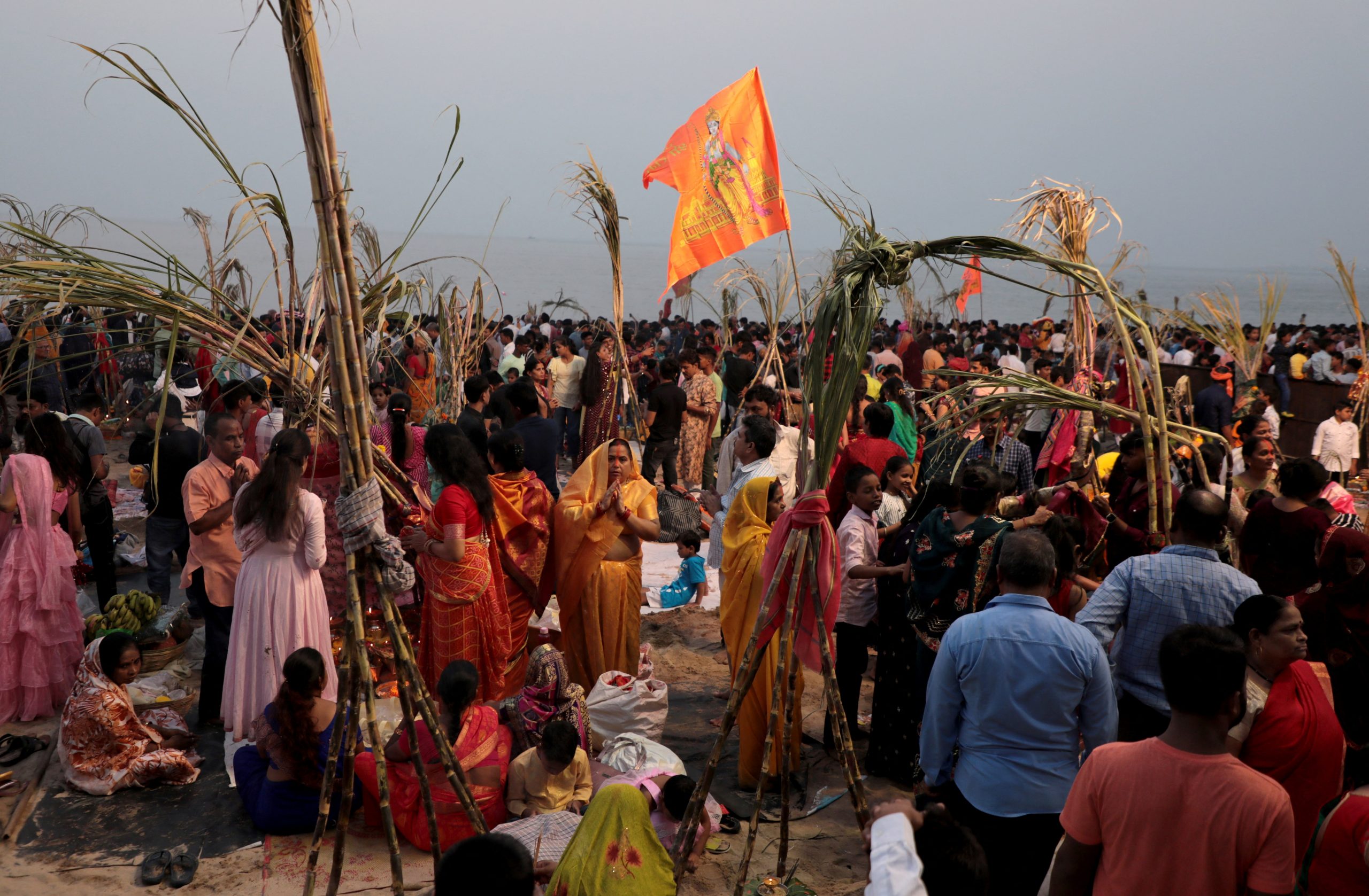 During Chhath Puja in Mumbai, devotees worship the Sun god and carry out rituals.